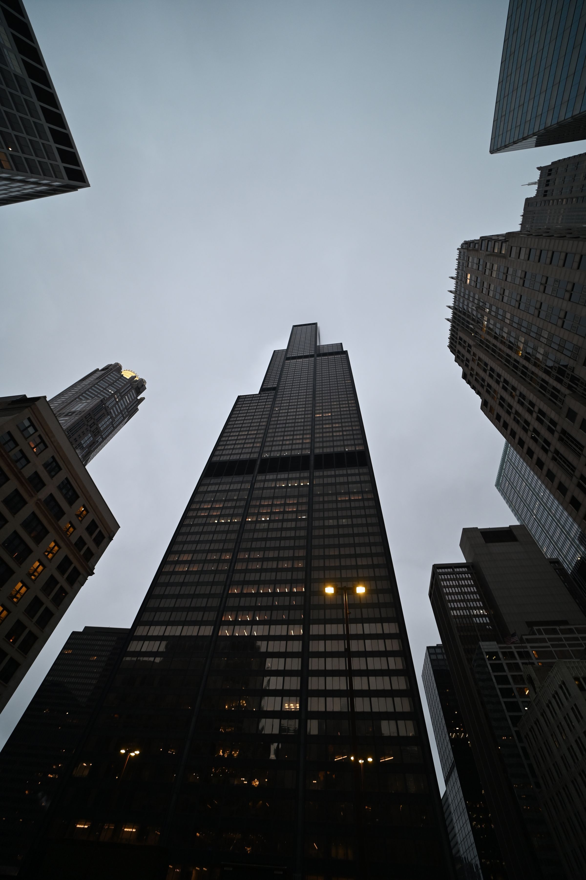 Glass office tower at dusk